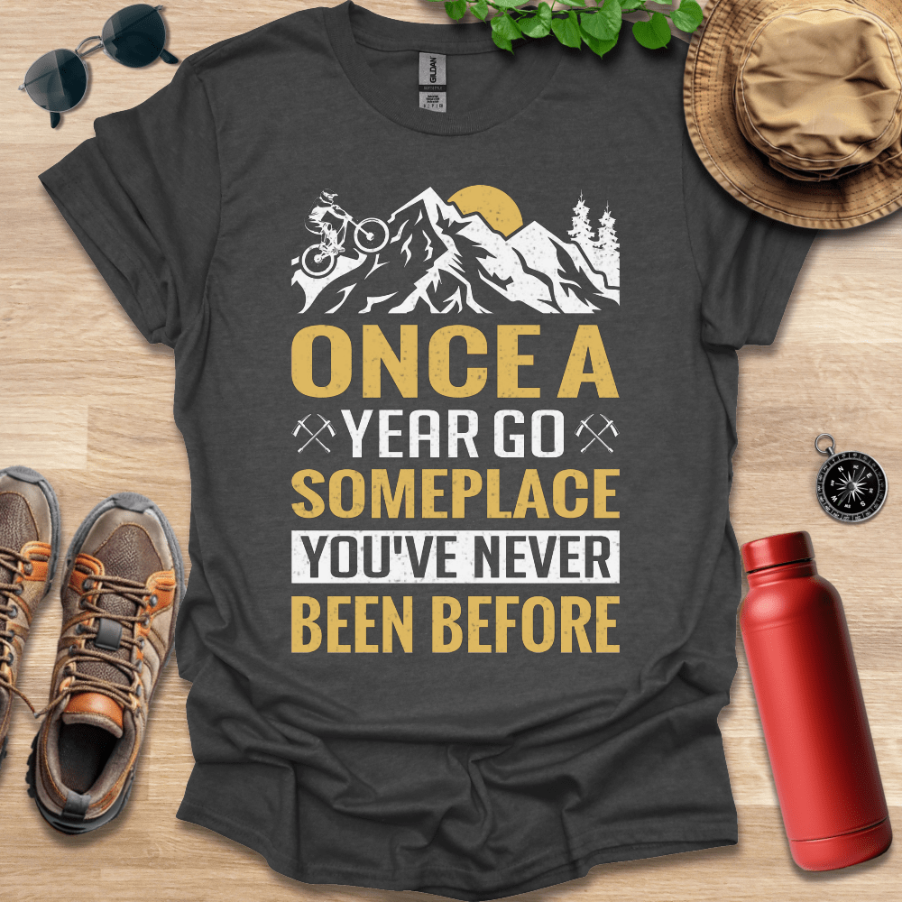 a t - shirt that says once a year go someplace you've never been
