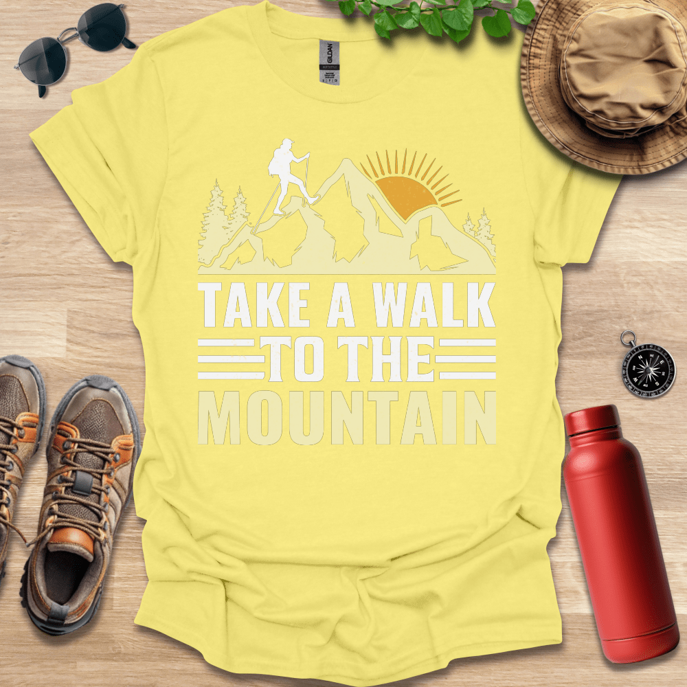 a yellow shirt that says take a walk to the mountain