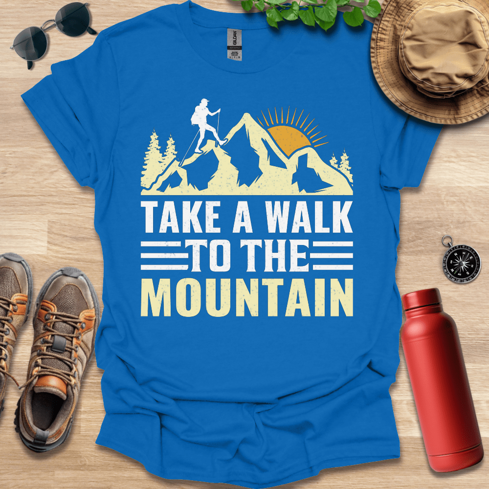 a blue shirt that says take a walk to the mountain