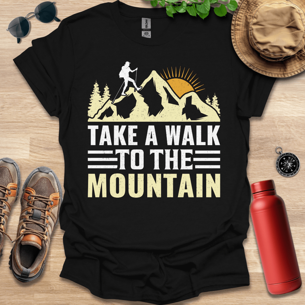 a black shirt that says take a walk to the mountain