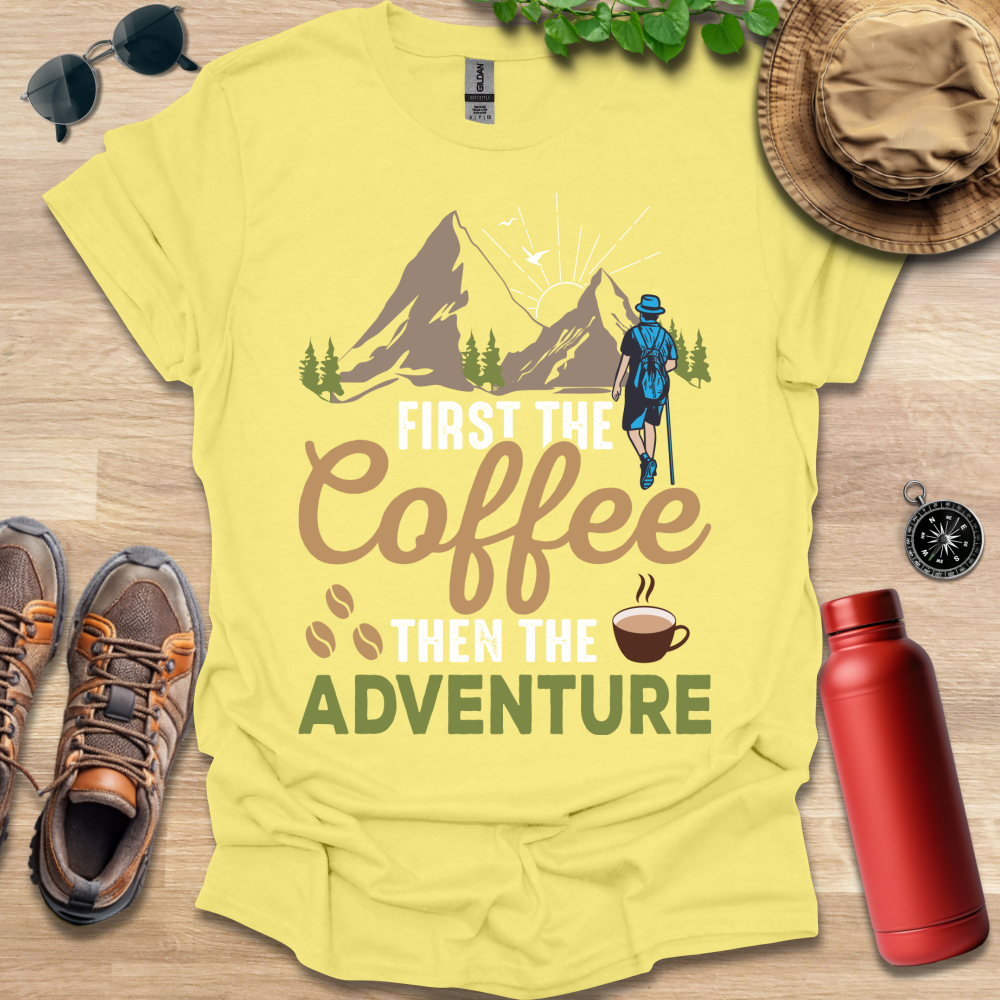 a t - shirt that says, first the coffee then the adventure