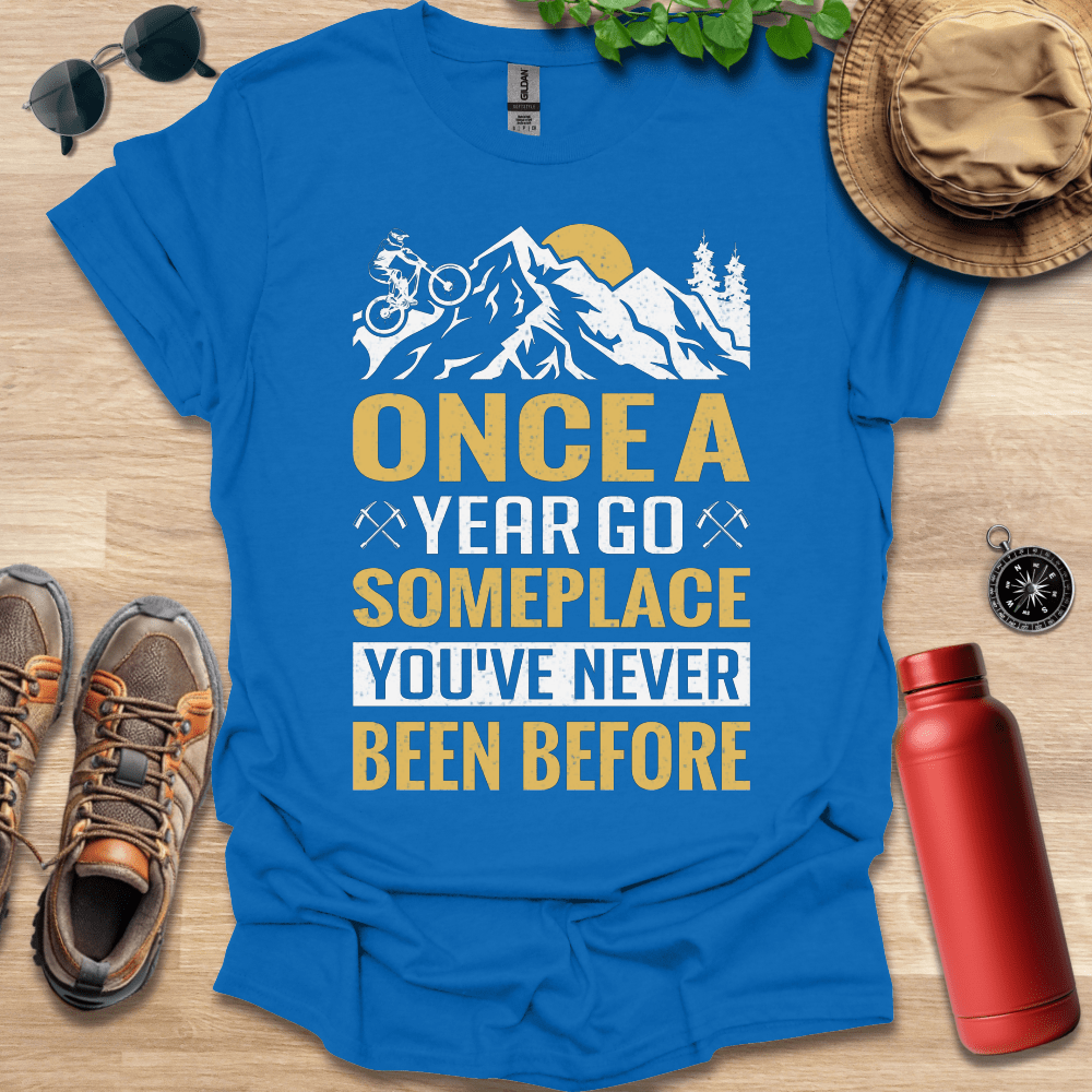 a t - shirt that says once a year go someplace you've never been