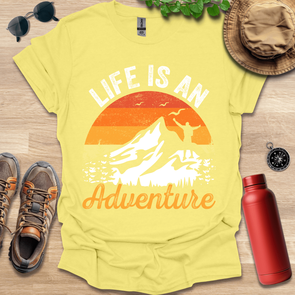 a yellow t - shirt with the words life is an adventure on it