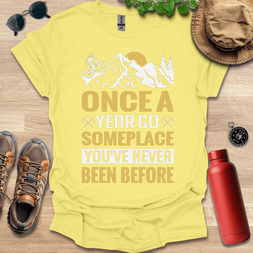 a t - shirt that says once a year go someplace you've never been