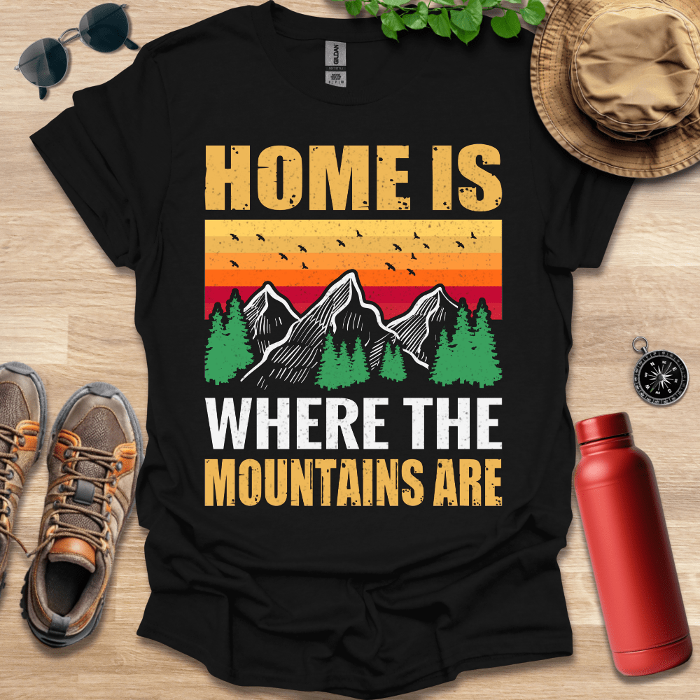 a black shirt that says home is where the mountains are