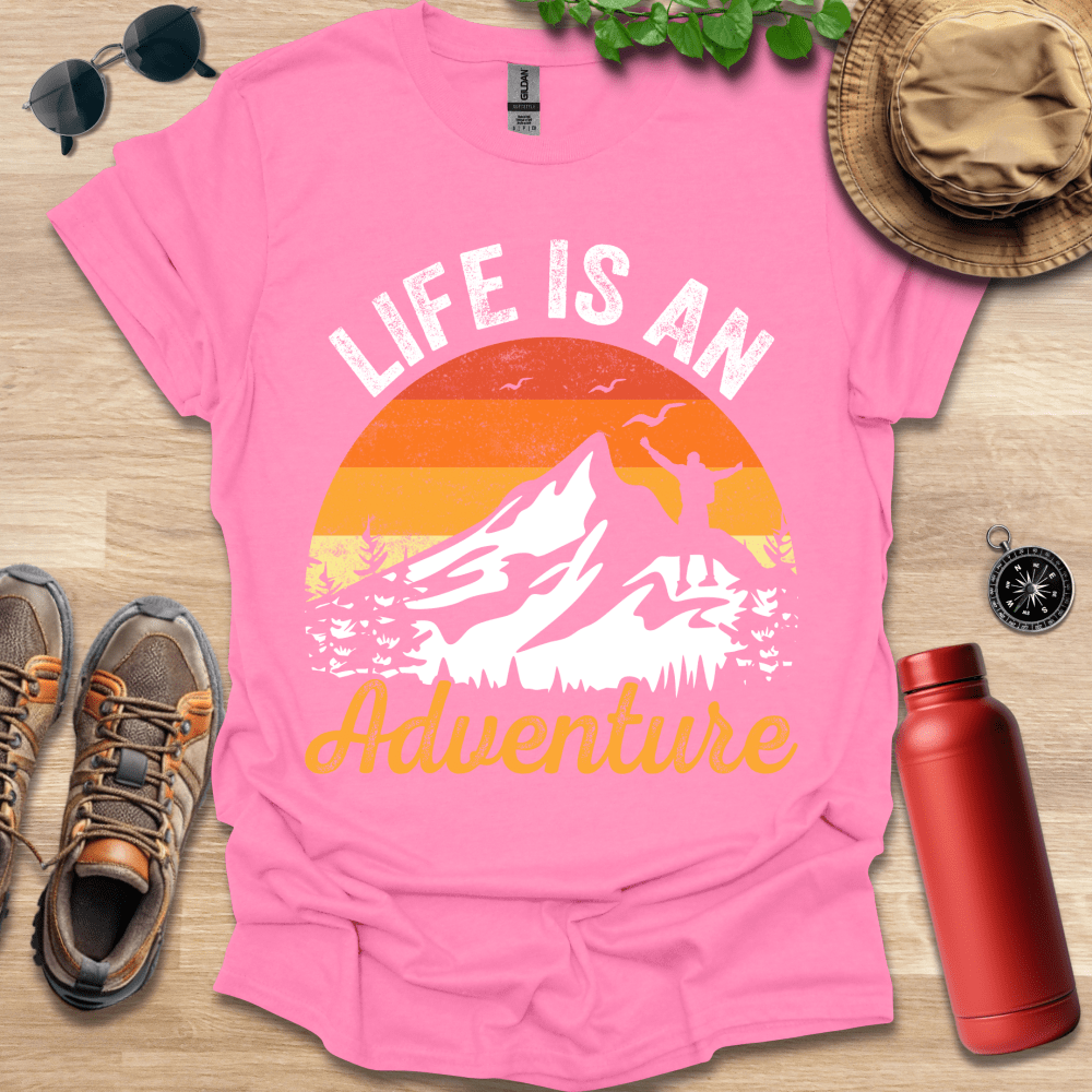 a pink shirt that says life is an adventure