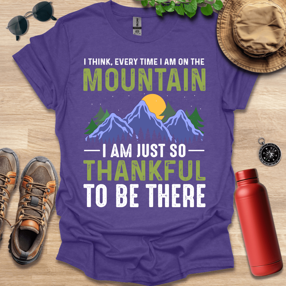 a purple shirt that says i think every time i am on the mountain i am