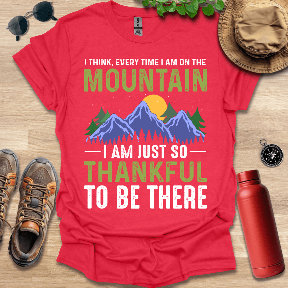 a red shirt that says i think every time i am on the mountain i am