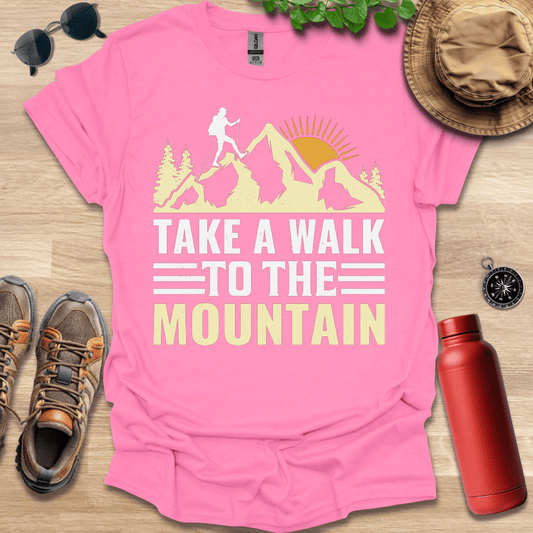 a pink shirt that says take a walk to the mountain