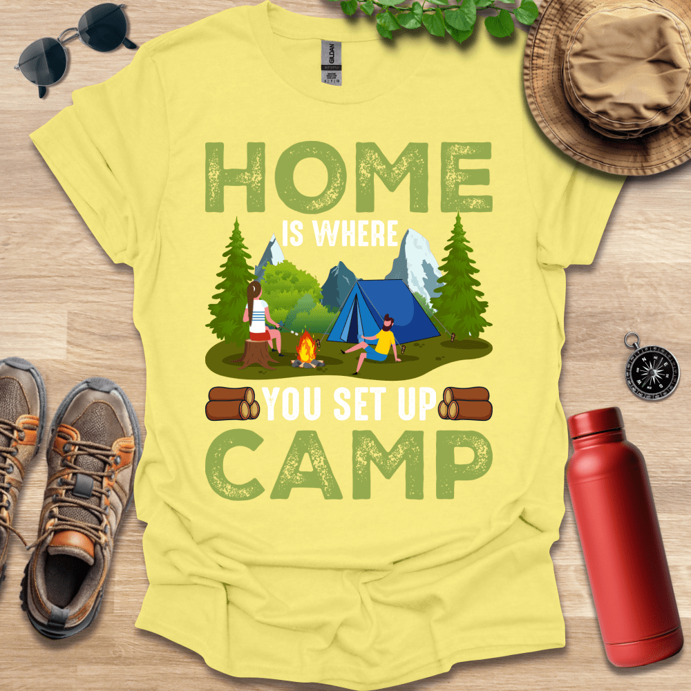 a yellow t - shirt with a camp scene on it