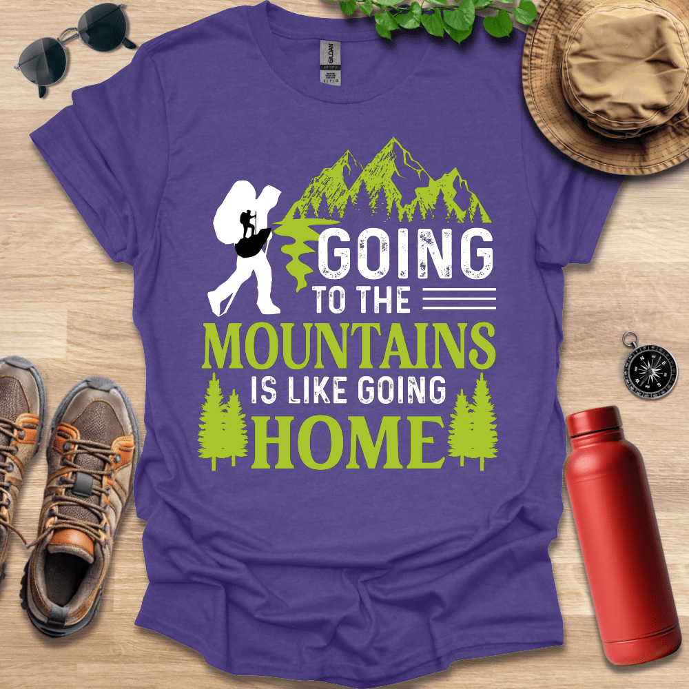 a purple shirt that says going to the mountains is like going home