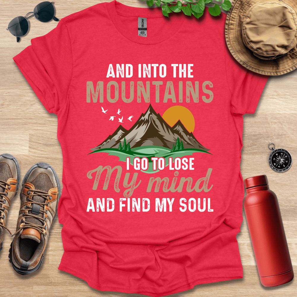 a red shirt that says and into the mountains i go to lose my mind and