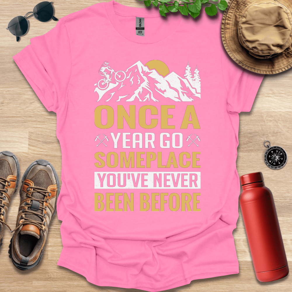 a t - shirt that says once a year go someplace you've never been