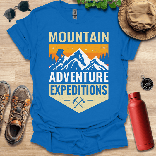 a blue shirt that says mountain adventure expedition