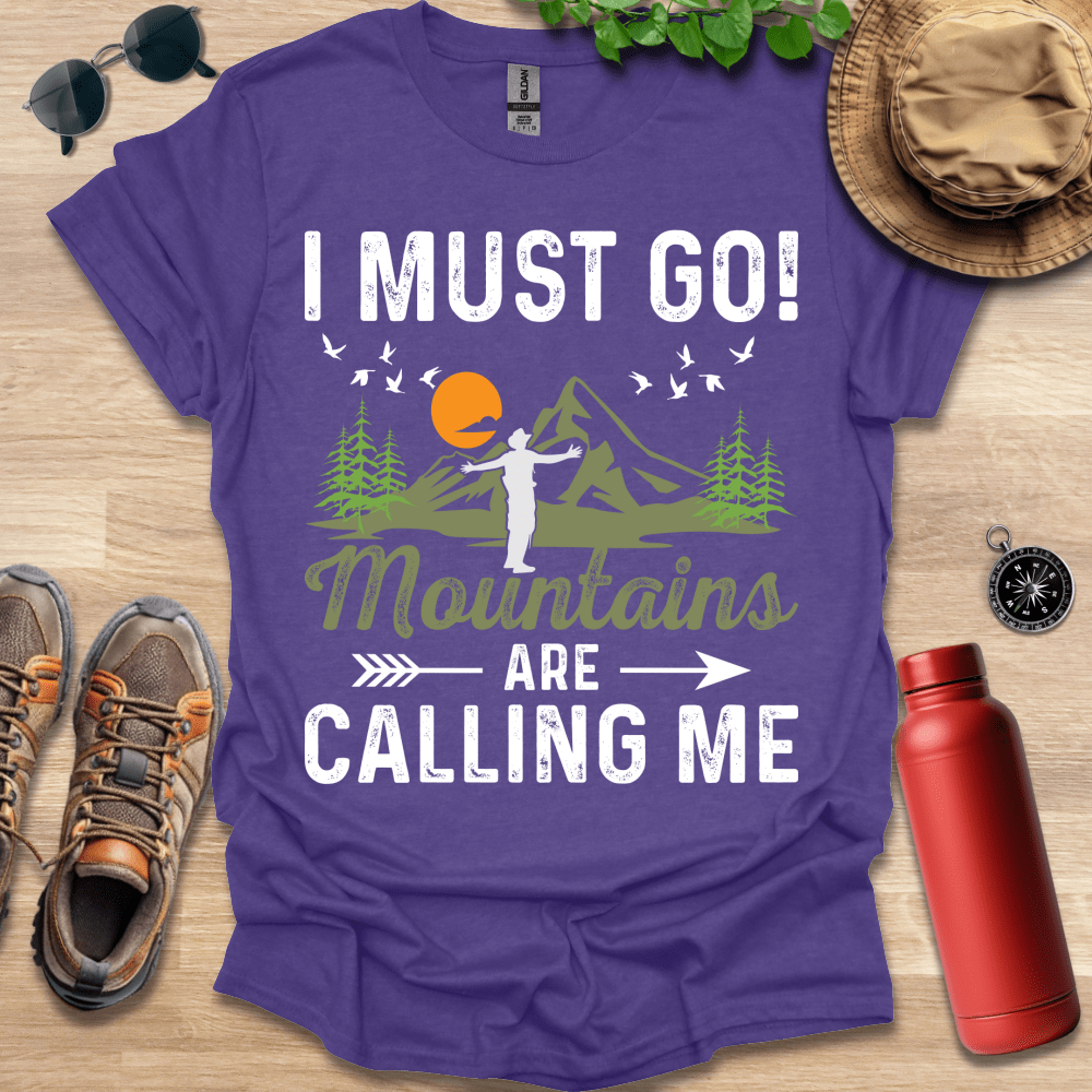 a purple shirt that says i must go mountains are calling me