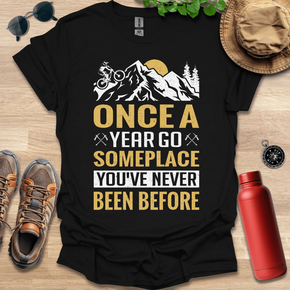 a t - shirt that says once a year go someplace you've never been