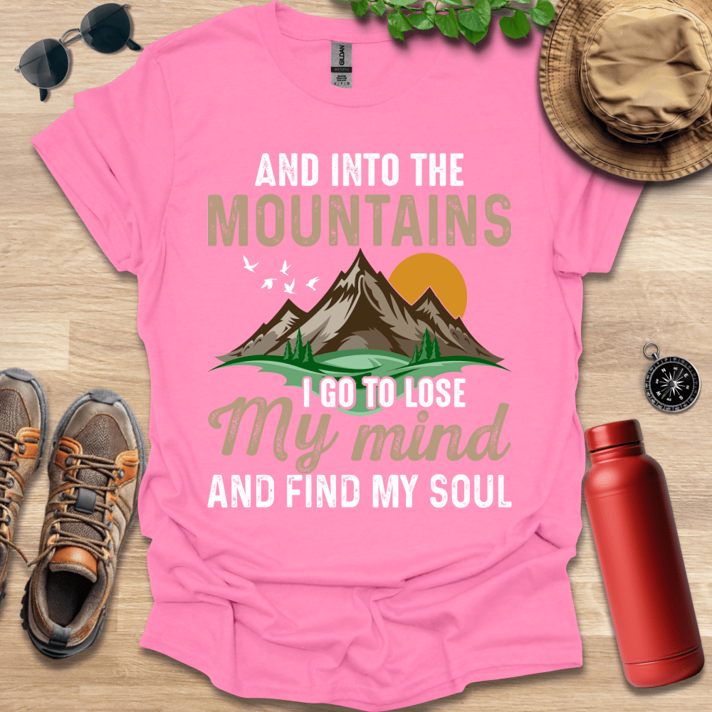 a pink shirt that says and into the mountains i go to lose my mind and