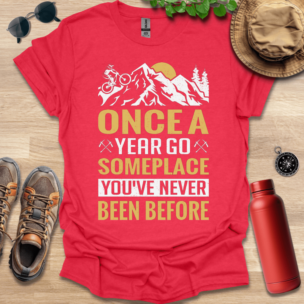 a t - shirt that says once a year go someplace you've never been