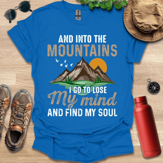 a blue shirt that says and into the mountains i go to lose my mind and