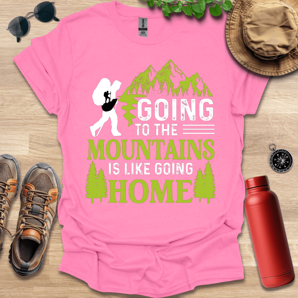 a pink shirt that says going to the mountains is like going home