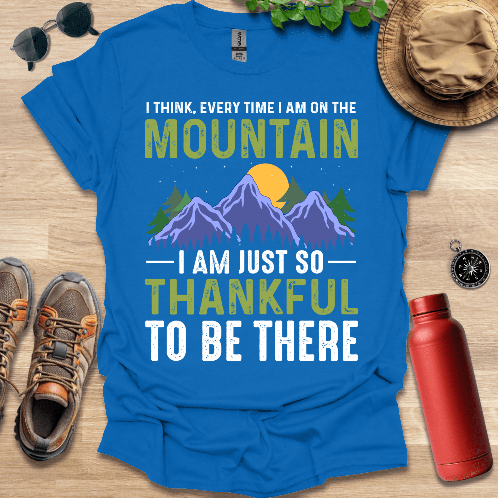 a blue shirt that says i think every time i am on the mountain i am