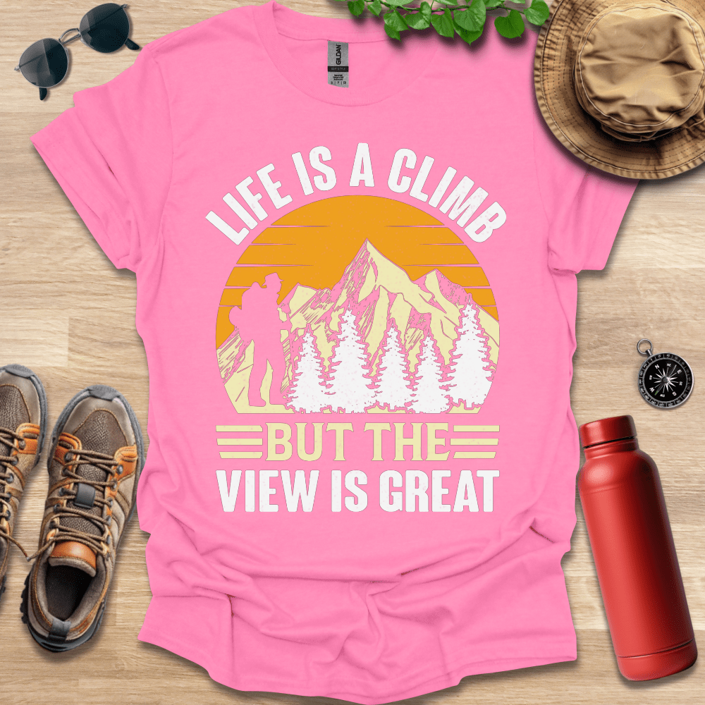 a pink shirt that says life is a climb but the view is great